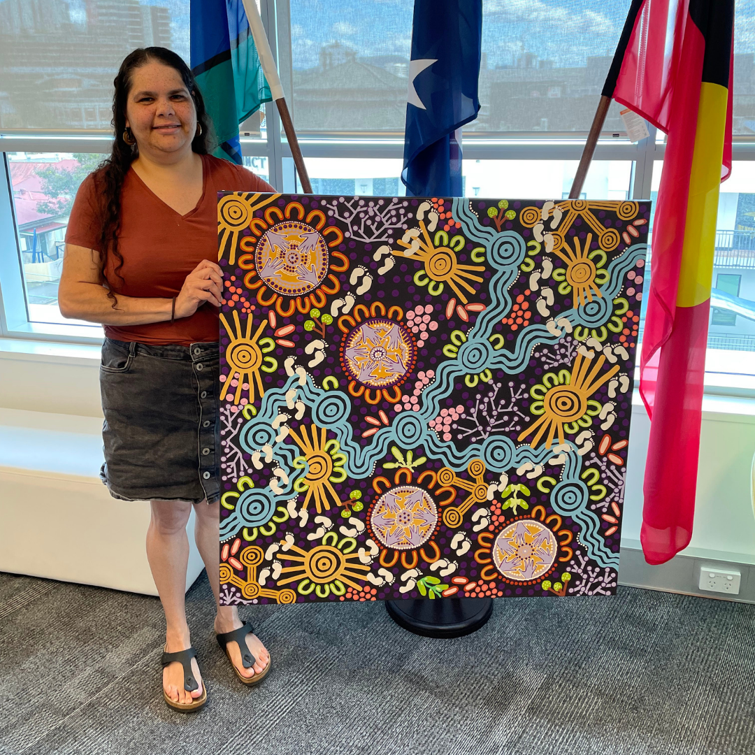 Leah Cummins pictured with her painting 'Stronger connection creates strong health'.